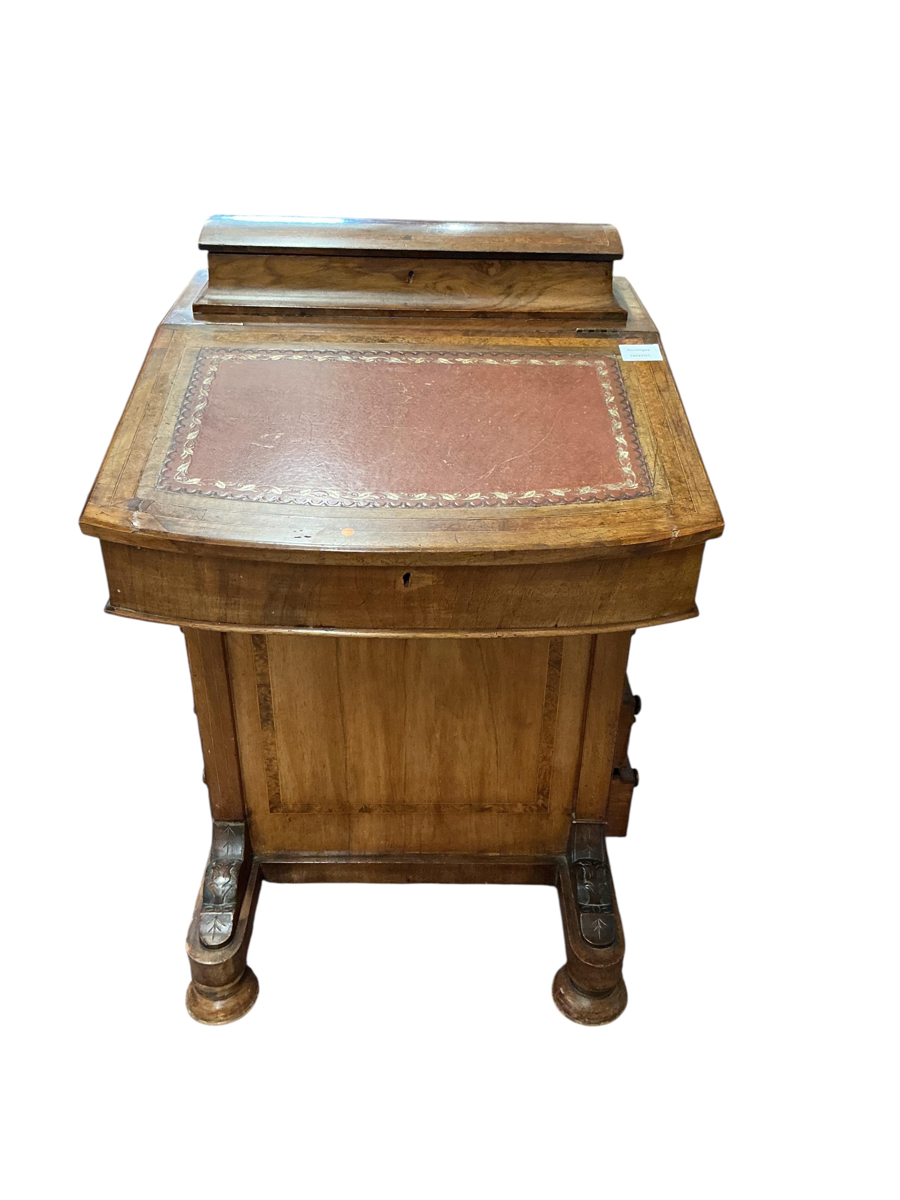 A late Victorian banded walnut Davenport, width 53cm, depth 54cm, height 84cm